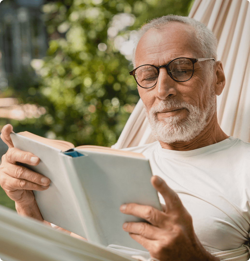 Elderly man enjoying a book